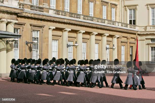 Footguards of the Household Division in bearskin hats and grey coats at Buckingham Palace await the arrival of the Norwegian Royal Family on October...
