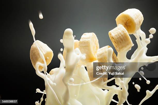 milk lift banana - yellow smoothie stock pictures, royalty-free photos & images