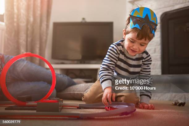 a father and son playing with toy cars - toy cars photos et images de collection