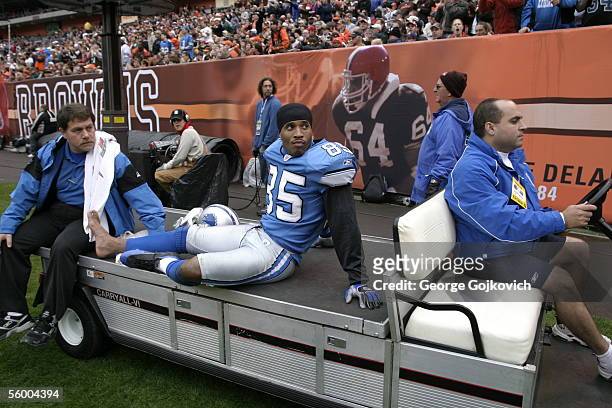 Injured wide receiver Kevin Johnson of the Detroit Lions is taken from the field on a cart during a game against the Cleveland Browns at Cleveland...