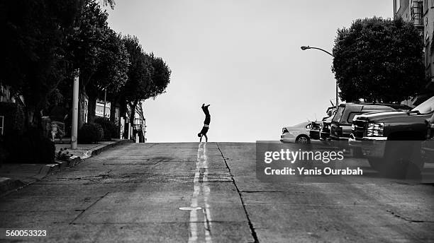 balance in san francisco streets - hill street stock pictures, royalty-free photos & images