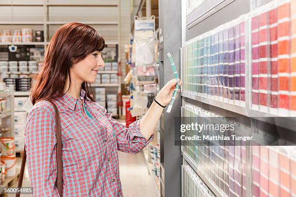 looking for a new color in a hardware store - baumarkt stock pictures, royalty-free photos & images