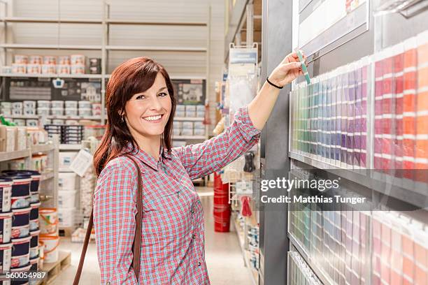 looking for a new color in a hardware store - baumarkt stock pictures, royalty-free photos & images