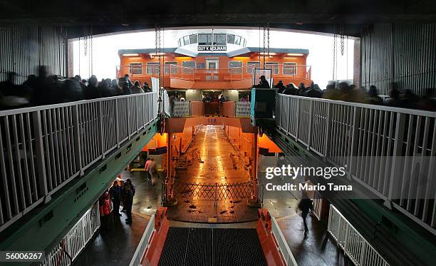 People board a Staten Island ferry at the St.George terminal in Staten Island on its 100th anniversary October 25, 2005 in New York City. In 1905,...