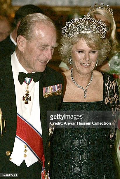 Prince Philip, Duke of Edinburgh and Camilla, Duchess of Cornwall smile together as they pose before the banquet for the Norwegian Royal Family at...