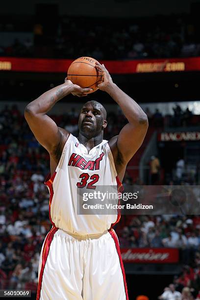Shaquille O'Neal of the Miami Heat shoots a free throw during the Hurricane Katrina Relief Benefit Game with the San Antonio Spurs at American...