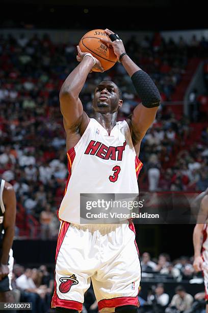 Dwyane Wade of the Miami Heat takes a jump shot during the Hurricane Katrina Relief Benefit Game with the San Antonio Spurs at American Airlines...