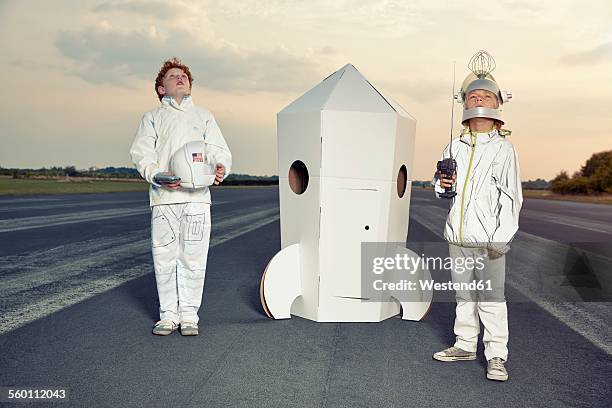 two boys dressed up as spacemen standing at cardboard rocket - looking up vintage stock pictures, royalty-free photos & images