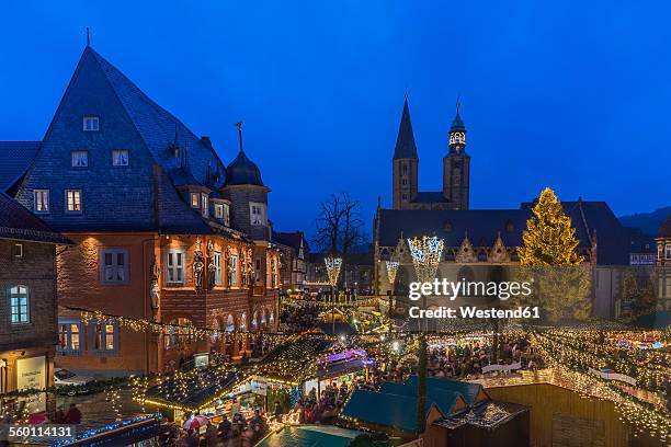 germany, lower saxony, goslar, christmas market in the evening - goslar stock pictures, royalty-free photos & images
