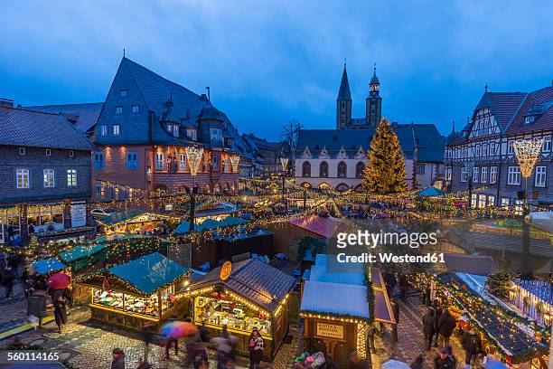 germany, lower saxony, goslar, christmas market in the evening - goslar stockfoto's en -beelden