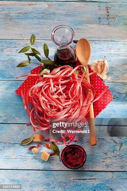 barolo tagliatelle, parmesan, garlic, tomato pesto and carafe of red wine - red salvia stock pictures, royalty-free photos & images