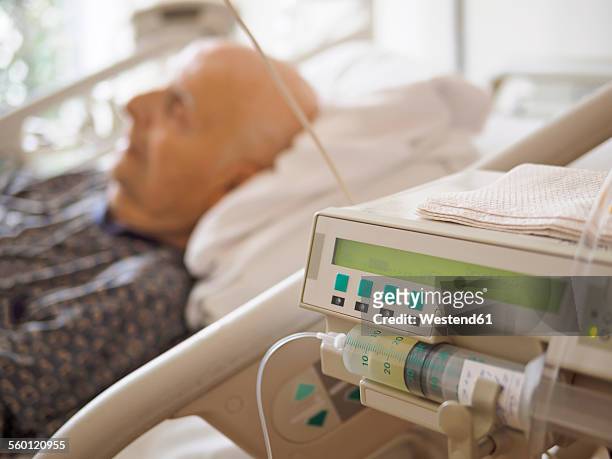 senior man at palliative care unit - tod stock-fotos und bilder