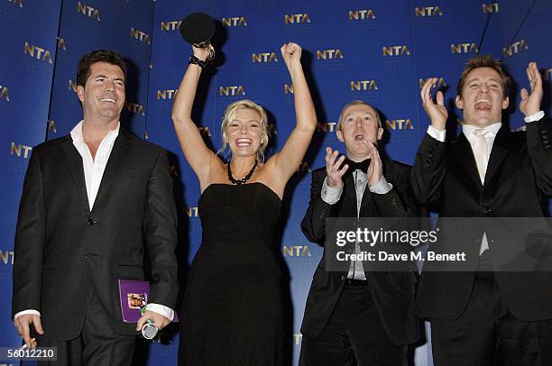 Producer Simon Cowell, presenter Kate Thornton, producer Louis Walsh and Ben Shepherd pose in the awards room with the Most Popular Entertainment...