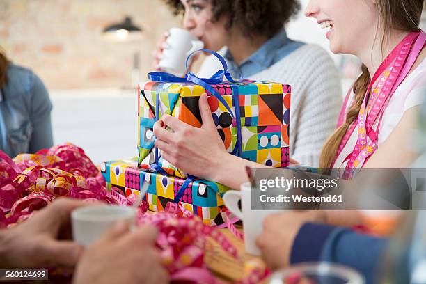 group of friends celebrating birthday - gift lounge stock-fotos und bilder