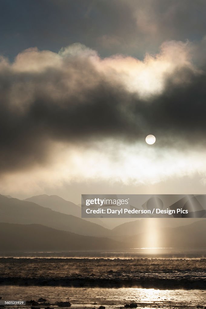 Pillar of light appears as fog lifts over Turnagain Arm