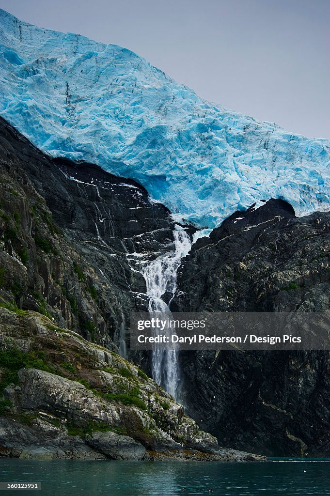 Waterfall flowing off a glacier