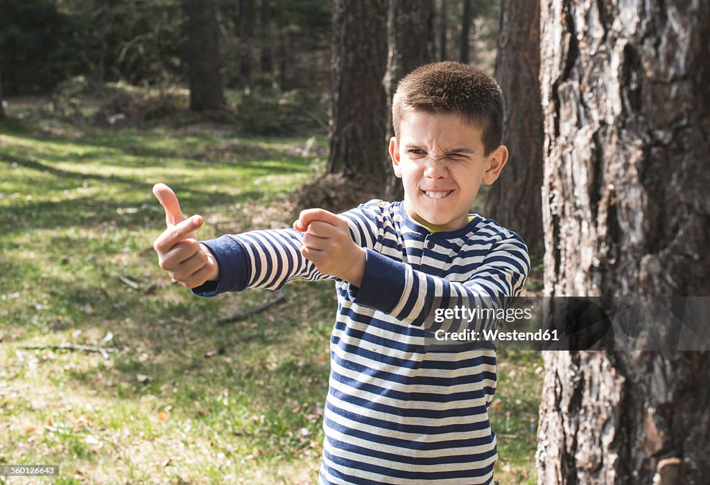 Portrait of boy playing in a forest