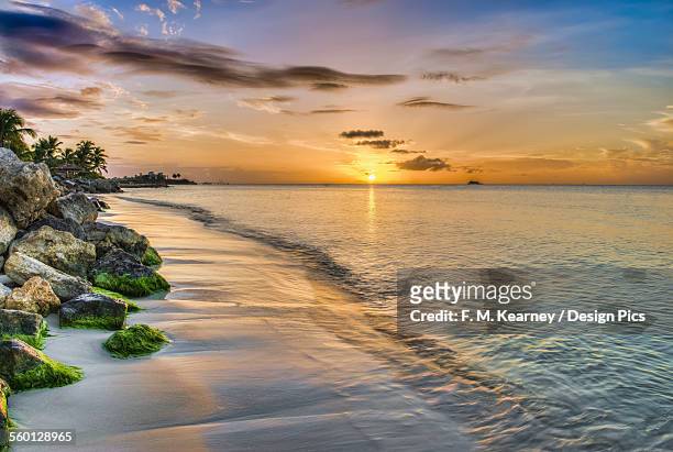sunset over dickenson bay - antigua leeward islands stock-fotos und bilder