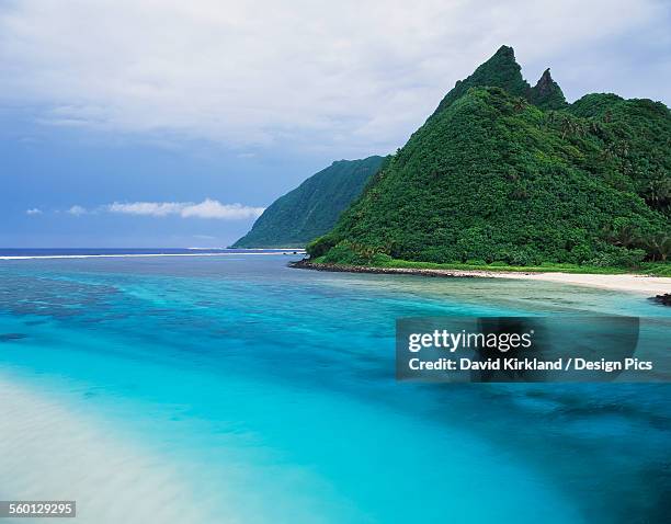 a river channel running through ofu island - ofu island stock pictures, royalty-free photos & images