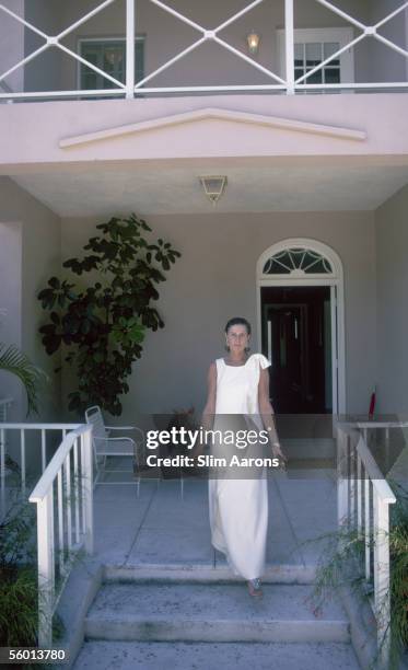 American socialite Nancy 'Slim' Keith, Lady Keith steps onto her porch in Lyford Cay, New Providence Island, April 1974.