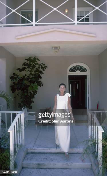 American socialite Nancy 'Slim' Keith, Lady Keith steps onto her porch in Lyford Cay, New Providence Island, April 1974.