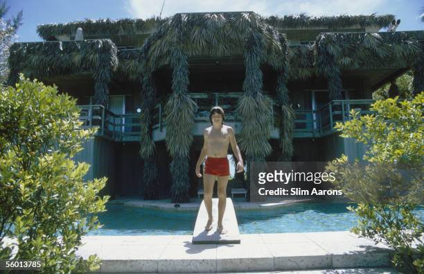 Filmmaker Anthony Radziwill makes use of the swimming pool at the Heinz House in Lyford Cay, New Providence Island, April 1974.
