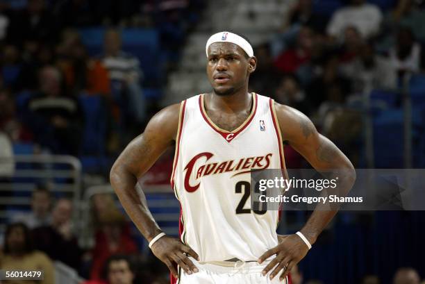 LeBron James of the Cleveland Cavaliers rests his arms on his hips during the preseason game against the Memphis Grizzlies on October 19, 2005 in...