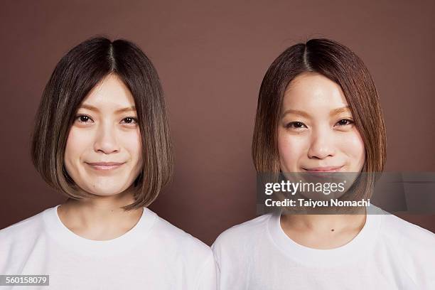 291 Identical Asian Twins Stock Photos, High-Res Pictures, and