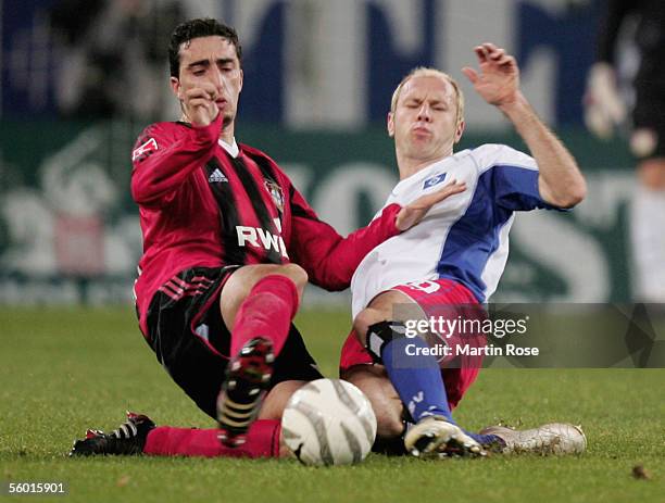 Ahmed Madouni of Leverkusen and Sergej Barbarez of Hamburg fight for the ball during the DFB German Cup second round match between Hamburger SV and...