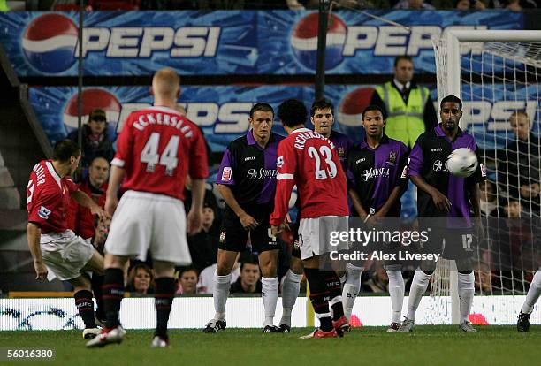 Liam Miller of Manchester United scores the first goal from a free kick during the Carling Cup third round match between Manchester United and Barnet...