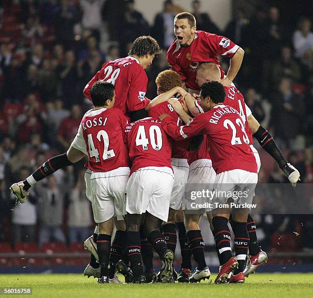 Liam Miller of Manchester United celebrates scoring the first goal during the Carling Cup third round match between Manchester United and Barnet at...