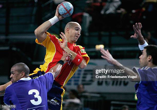 Demetrio Lozano of Spain tussels for the ball with Didier Dinart and Franck Junillon of France during the handball QS Supercup match between France...