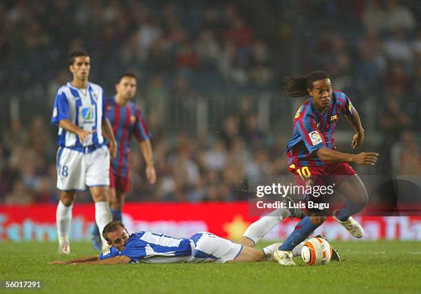 Ronaldinho of Barcelona plays the ball during the match between FC Barcelona and Malaga of the Spanish Primera Liga at the Camp Nou stadium in...