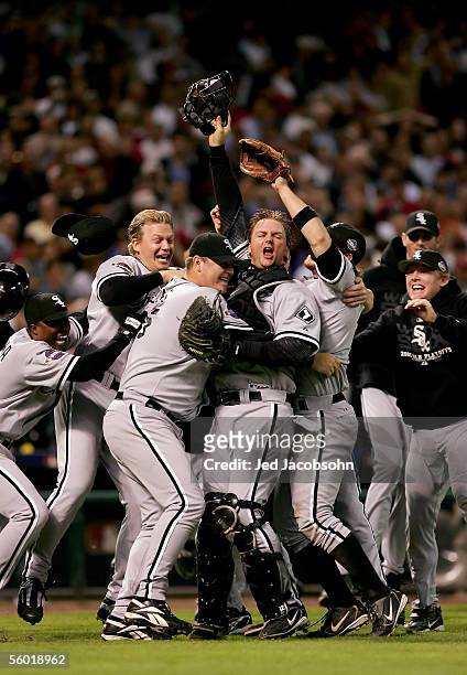 Catcher A.J. Pierzynski hugs pitcher Bobby Jenks as they and the rest of the Chicago White Sox celebrate after winning Game Four of the 2005 Major...