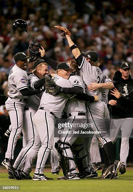 Catcher A.J. Pierzynski hugs pitcher Bobby Jenks as they and the rest of the Chicago White Sox celebrate after winning Game Four of the 2005 Major...
