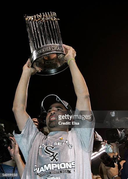 Manager Ozzie Guillen of the Chicago White Sox celebrates with the Championship trophy after winning Game Four of the 2005 Major League Baseball...