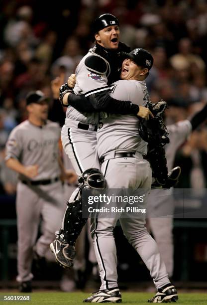 Bobby Jenks and A.J. Pierzynski of the Chicago White Sox celebrate after winning the 2005 World Series in four games against the Houston Astros at...