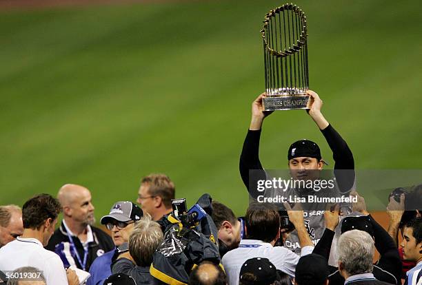 Pitcher Freddy Garcia of the Chicago White Sox celebrates with the Championship Trophy after winning Game Four of the 2005 Major League Baseball...