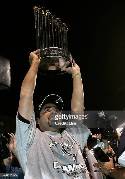 Manager Ozzie Guillen of the Chicago White Sox celebrates with the Championship Trophy after winning Game Four of the 2005 Major League Baseball...