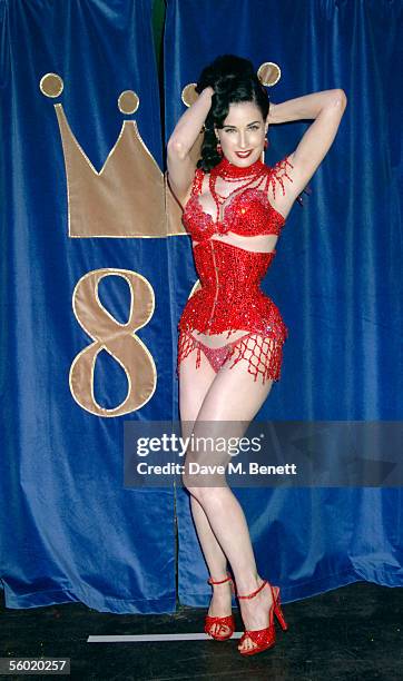 Burlesque artist Dita Von Teese performs on stage at Cafe De Paris' 80th birthday on October 27, 2005 in London, England.