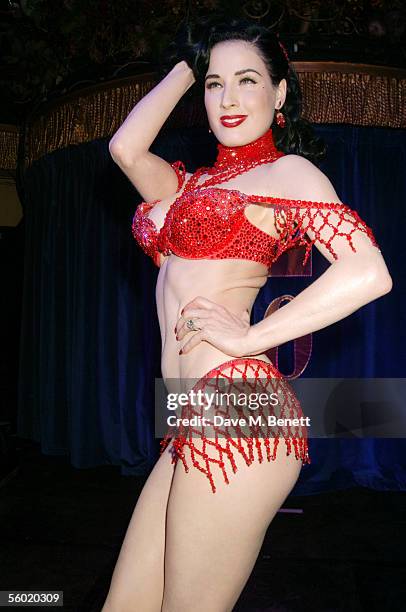 Burlesque artist Dita Von Teese performs on stage at Cafe De Paris' 80th birthday on October 27, 2005 in London, England.