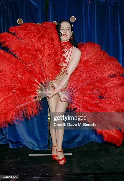 Burlesque artist Dita Von Teese performs on stage at Cafe De Paris' 80th birthday on October 27, 2005 in London, England.