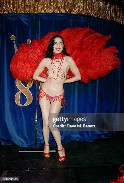 Burlesque artist Dita Von Teese performs on stage at Cafe De Paris' 80th birthday on October 27, 2005 in London, England.