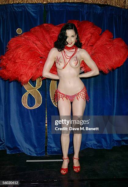 Burlesque artist Dita Von Teese performs on stage at Cafe De Paris' 80th birthday on October 27, 2005 in London, England.
