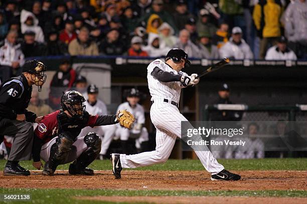 Scott Podsednik of the Chicago White Sox connects on a game winning, walk off home run in the ninth inning off Brad Lidge during Game 2 of the 2005...