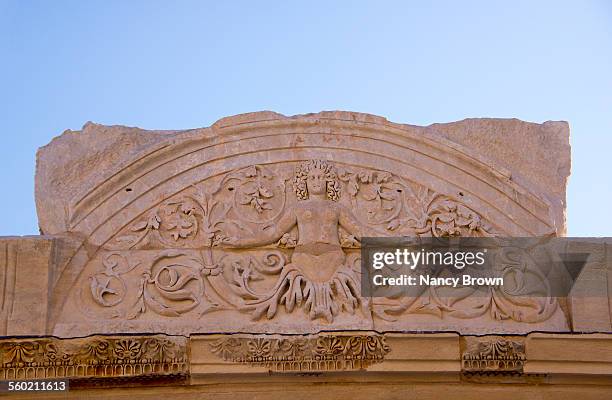 roman carving on temple hadrian, ephesus - ephesus stock pictures, royalty-free photos & images