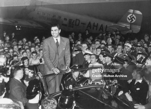 German heavyweight boxing champion Max Schmeling returns to Berlin to a hero's welcome after defeating American boxer Joe Louis in New York, 27th...