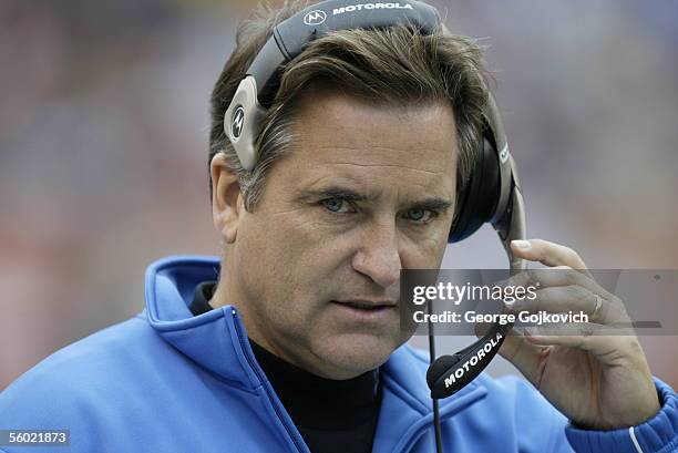 Head coach Steve Mariucci of the Detroit Lions adjusts his headset during a game against the Cleveland Browns at Cleveland Browns Stadium on October...