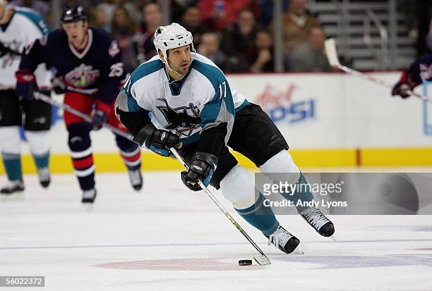 Scott Thornton of the San Jose Sharks skates the puck through the neutral zone against the Columbus Blue Jackets during their NHL game at Nationwide...