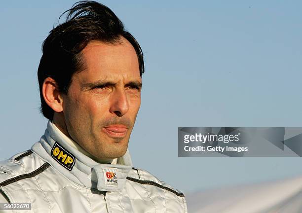 Alex Caffi of Italy looks down the pit lane during testing for the Grand Prix Masters Series at Silverstone Circuit on October 27, 2005 in...